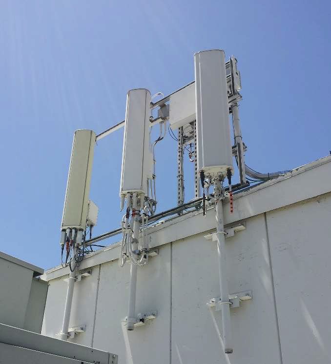 Telecommunications antennas mounted on a rooftop frame